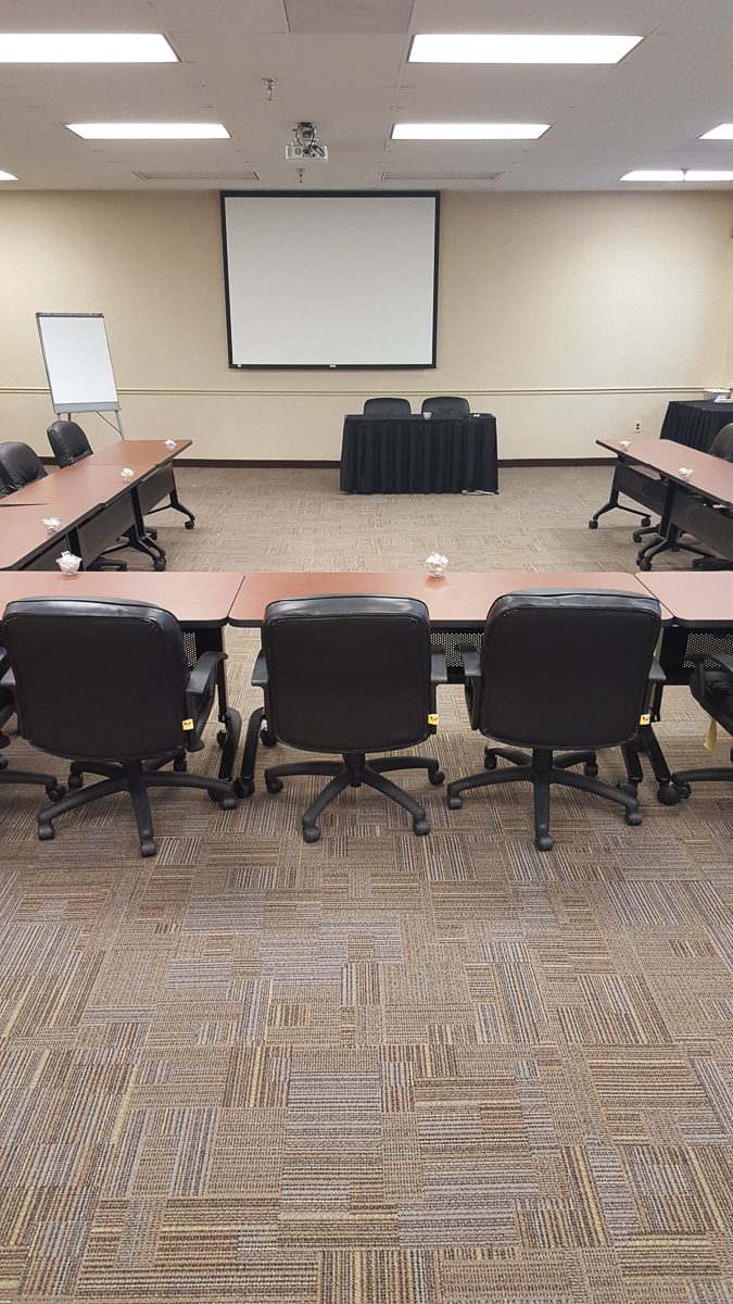 Empty conference room setup with projector
