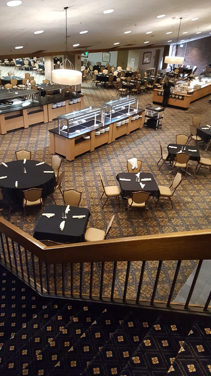 Spacious dining area with patterned carpet