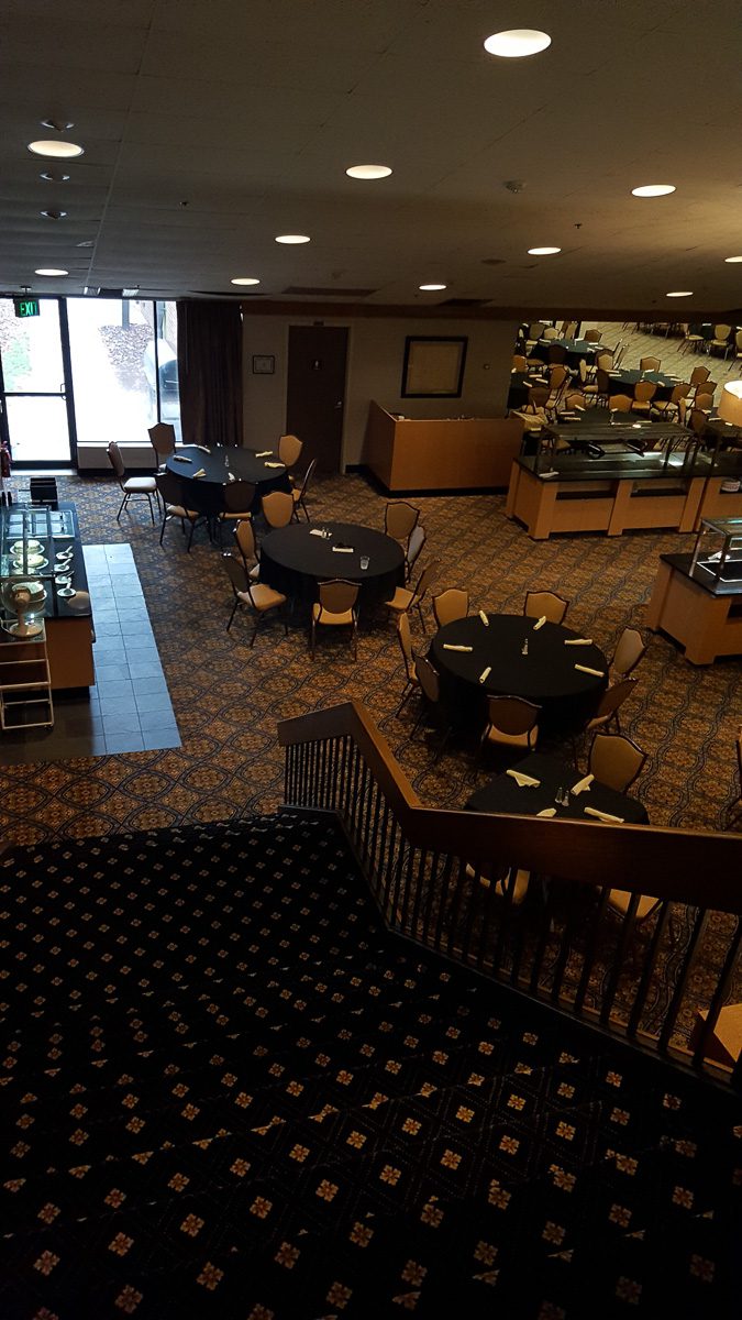 Carpeted dining area with set tables