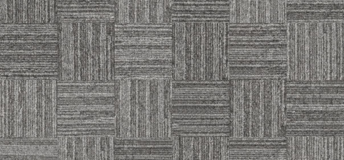 Gray patterned carpet tiles in geometric arrangement.