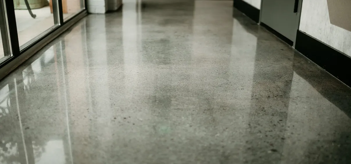 Shiny polished concrete floor in a hallway.