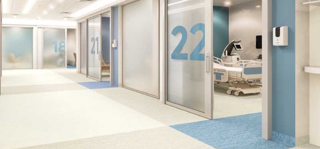 Hospital corridor with numbered patient rooms.