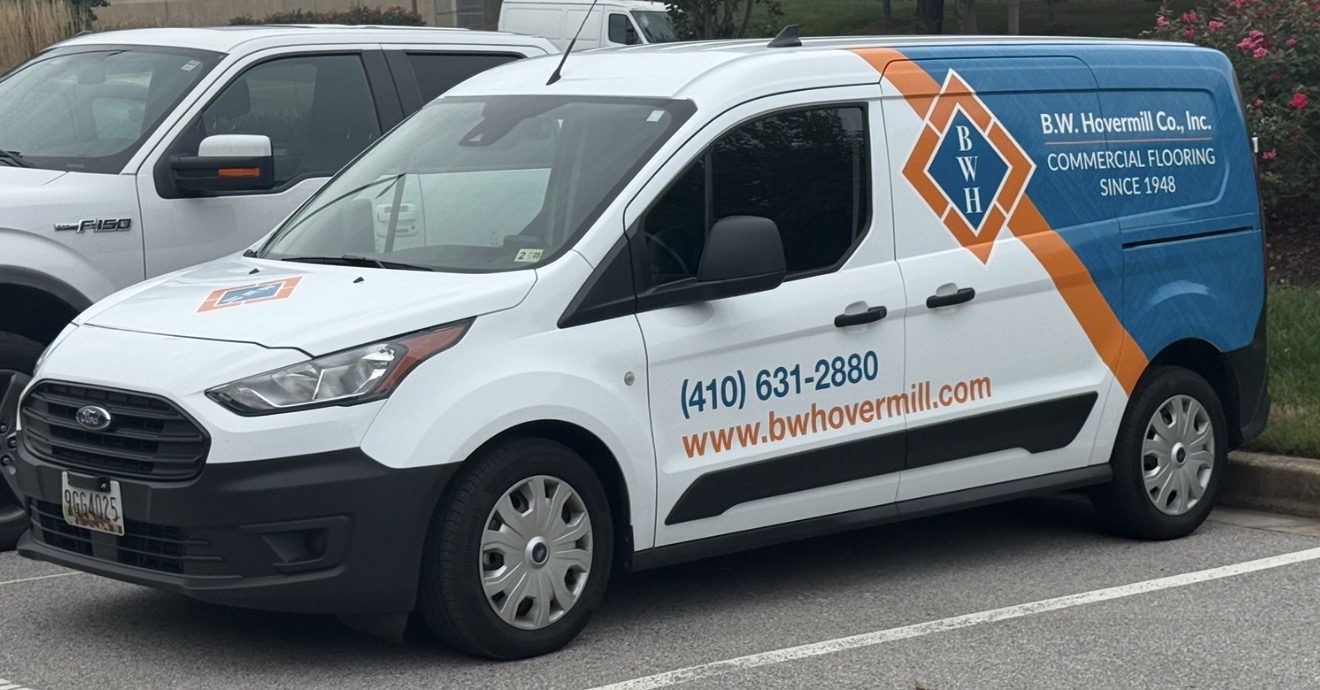 White commercial van with business branding.