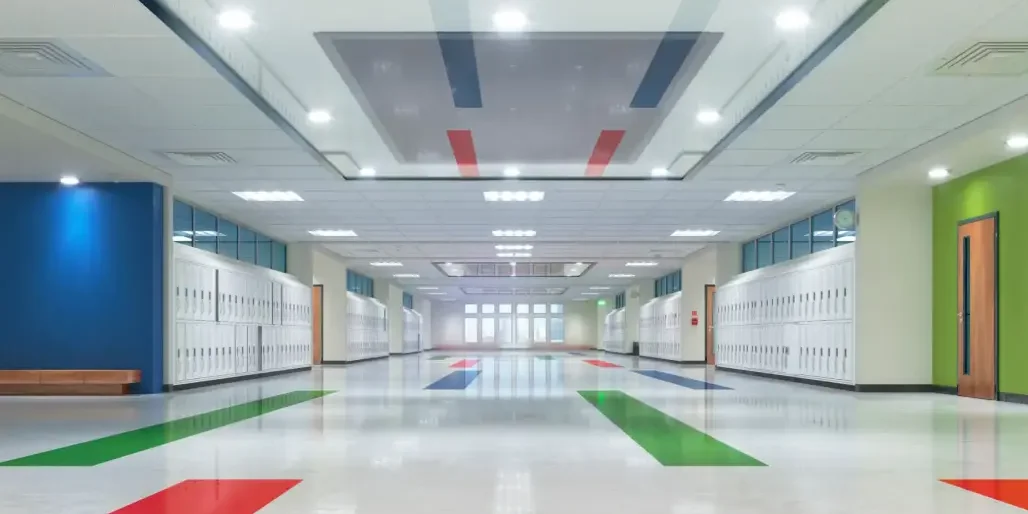 Bright, colorful school hallway with lockers.